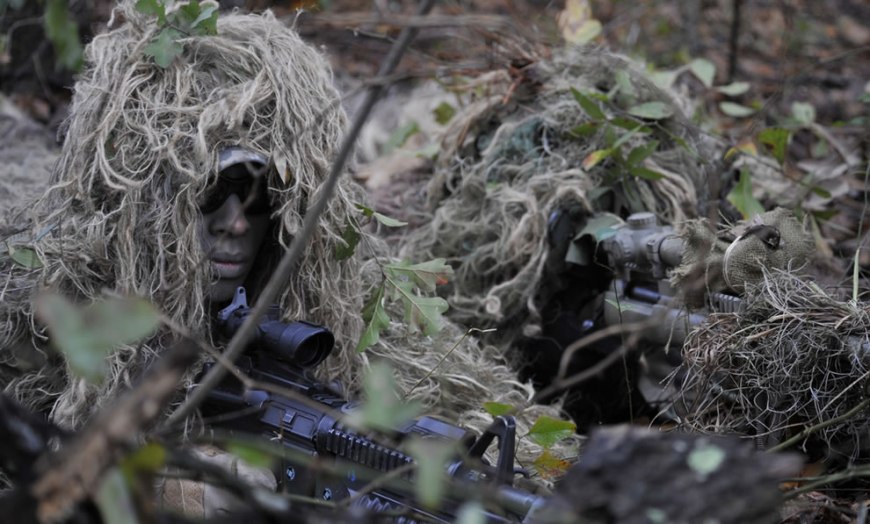 U.S. Air Force Senior Airman Antwone Dunlap, left, a sniper team spotter, and Airman 1st Class Ricky Smith, a sniper team shooter, both assigned to the 822nd Base Defense Squadron, prepare to provide cover fire for Airman during an urban operations training demonstration at Moody Air   Force Base