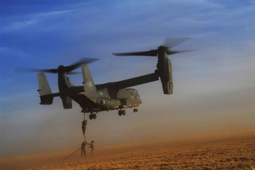 U.S. Army soldiers with Alpha Company, 4th Battalion, 10th Special Forces Group fast-rope from a CV-22 Osprey tiltrotor aircraft during exercise Emerald Warrior 2011